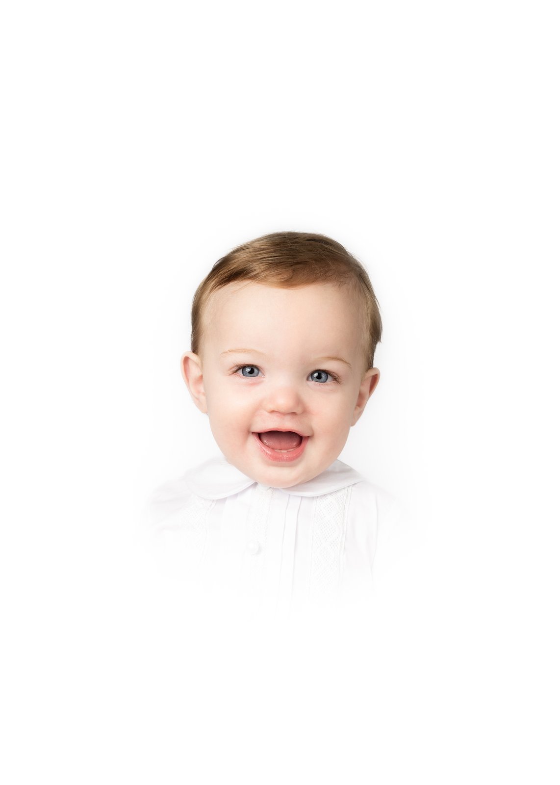 Heirloom portrait — a smiling toddler with bright blue eyes